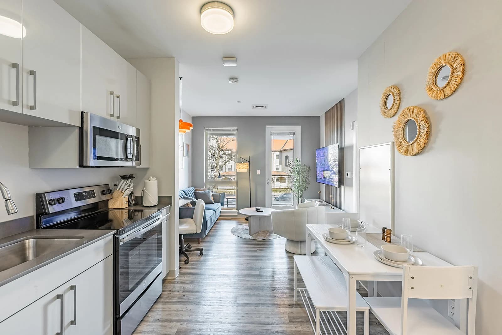 Bright finished R Living home in Greater Boston with an open kitchen, dining area, and living space